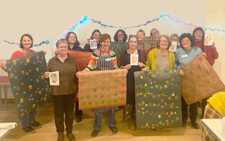 ladies holding up their cards and gift wrap altered