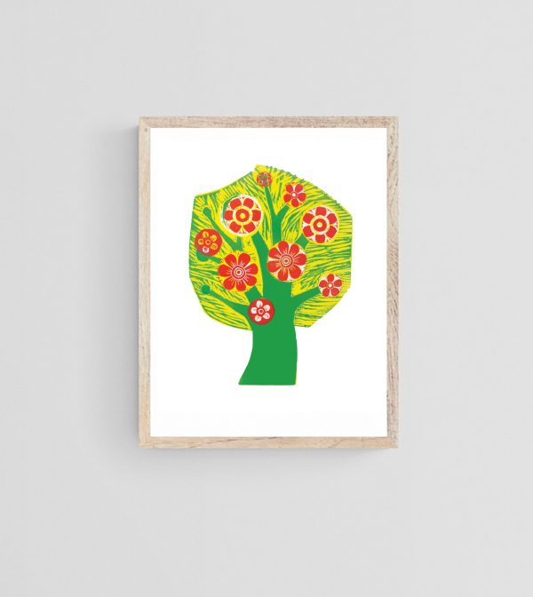 Framed tree in blossom print hanging on a wall
