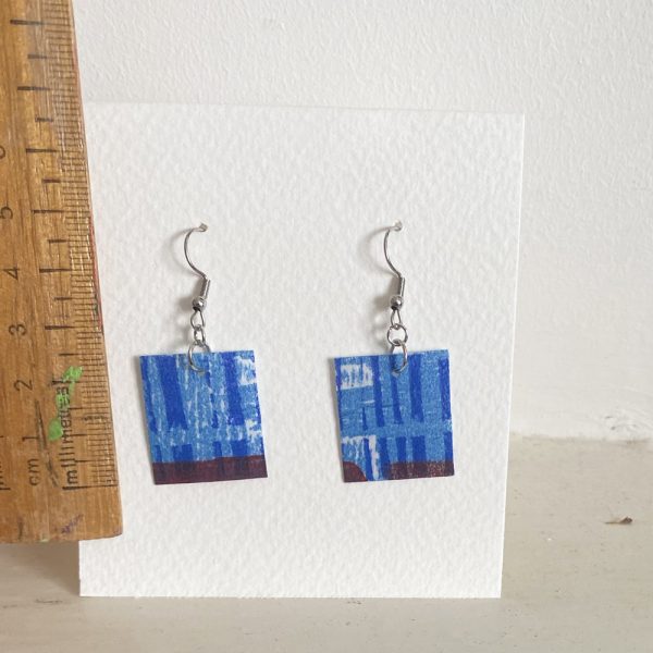 blue square earrings with ruler