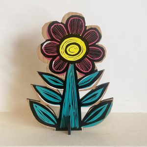 Green and yellow linocut printed flower on bamboo