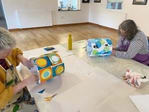 2 ladies constructing their lampshades