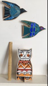 Ginger cat with ruler and birds