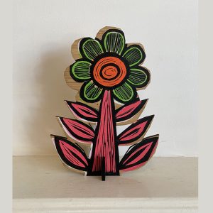 Orange flower on shelf