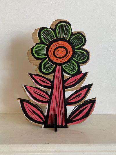 Orange flower on shelf