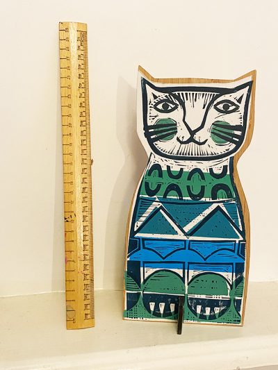 Clever Cat 1 with ruler showing height