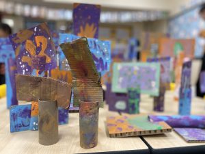 The finished 'Forest of Trees' displayed together on a table in the classroom.